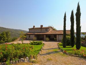 a house with trees and a garden in front of it at Spacious Villa in Ficulle with Pool in Ficulle