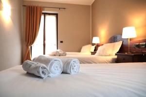 Postel nebo postele na pokoji v ubytování Hotel Ristorante Château