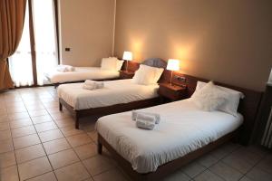 Postel nebo postele na pokoji v ubytování Hotel Ristorante Château