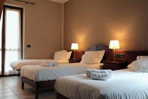 Postel nebo postele na pokoji v ubytování Hotel Ristorante Château
