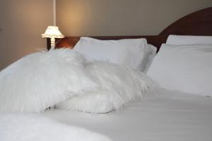 Ein Bett oder Betten in einem Zimmer der Unterkunft Hotel Ristorante Château