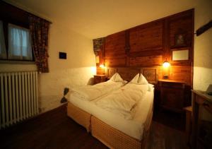 Postel nebo postele na pokoji v ubytování Eco Chalet Maison Dominique