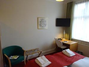 Postel nebo postele na pokoji v ubytování City Hotel Nebo
