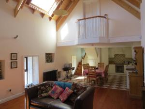 a living room with a couch and a table at The Old House in Carrick-on-Suir