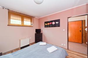Posteľ alebo postele v izbe v ubytovaní Apartamenty Sun & Snow Poronin