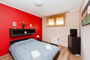 Televízia a/alebo spoločenská miestnosť v ubytovaní Apartamenty Sun & Snow Poronin