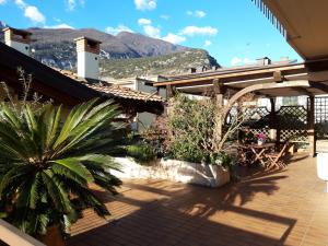 a patio with a view of a mountain at Appartamento la Terrazza in Arco