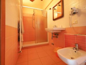 a bathroom with a sink and a toilet and a shower at Ginepro d'Abruzzo in Casamaina +60 photos