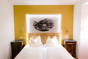 Łóżko lub łóżka w pokoju w obiekcie Schlosstaverne Thannhausen