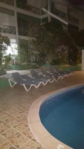 Der Swimmingpool an oder in der Nähe von TERRAZAS DEL CARIBE, APARTA HOTEL.