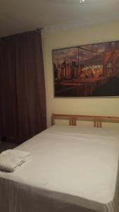 Postel nebo postele na pokoji v ubytování TERRAZAS DEL CARIBE, APARTA HOTEL.