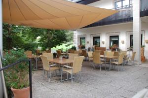 Restaurant ou autre lieu de restauration dans l'établissement Schlosstaverne Thannhausen