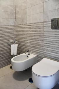 Kúpeľňa v ubytovaní Costantino Suites