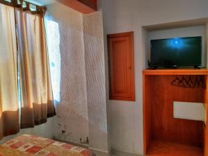 TV a/nebo společenská místnost v ubytování Hotel Sol del Pacifico