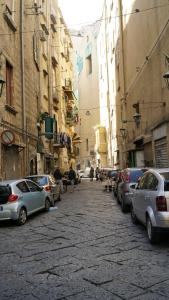 a street with cars parked on the side of a building at Donna Vicenza Bed & Breakfast in Naples +26 photos