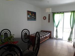 a bedroom with a bed and a window at Maraja1 in Mar de Ajó