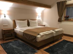 Кровать или кровати в номере Haus Planegg