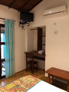 TV a/nebo společenská místnost v ubytování Pousada e Restaurante do Paulo