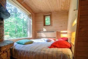 two pillows on a bed in a room with a window at Omaya Eco Village in Gaytaninovo +95 photos