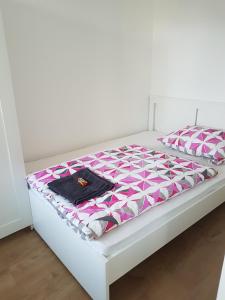 Posteľ alebo postele v izbe v ubytovaní Pelso apartman