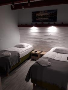 Posteľ alebo postele v izbe v ubytovaní Apartament Fenowe Wzgórze