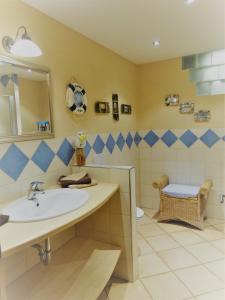 a bathroom with a sink and a toilet at Ferienwohnungen Koller in Bodenmais +22 photos