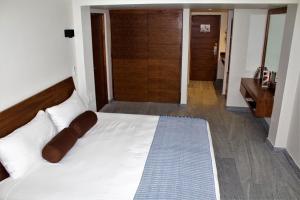 Postel nebo postele na pokoji v ubytování Hotel Plaza Kokai Cancún