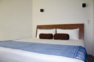 Postel nebo postele na pokoji v ubytování Hotel Plaza Kokai Cancún