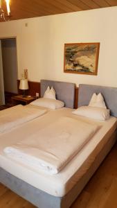 a pair of beds in a room at Appartmenthaus am Moosweg in Seefeld in Tirol