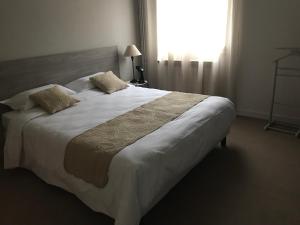 Letto o letti in una camera di Hôtel Pyrène