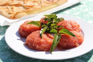 a plate of food with meatballs on a table at Villa Midolo in Noto Marina