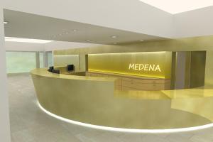 a meezena counter in a lobby with a yellow sign at Hotel Medena Budget in Trogir