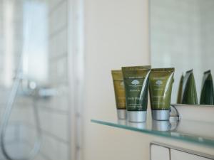 a shelf with some products on it in a bathroom at The Bell Inn in Worcester +43 photos