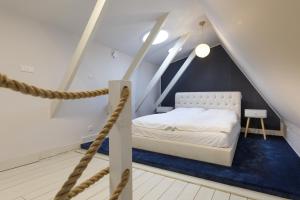 Postel nebo postele na pokoji v ubytování Apartamenty Vilda