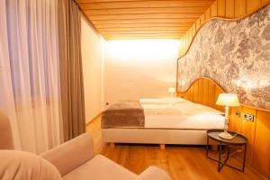 Postel nebo postele na pokoji v ubytování Das Landhaus Apartments Prägant