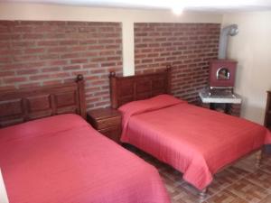 Postel nebo postele na pokoji v ubytování Cabañas las Gemelas