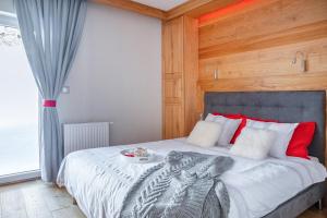 Un pat sau paturi într-o cameră la Apartament Skrzyczne