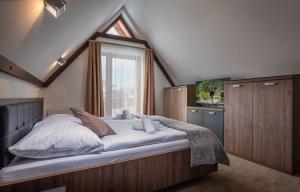 A bed or beds in a room at Apartmany Krasvill