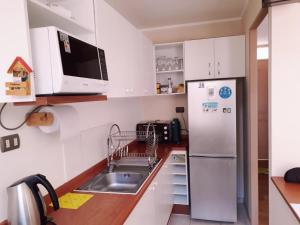 Kuchyň nebo kuchyňský kout v ubytování Departamento Bosques del Tabo