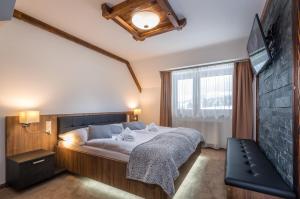 A bed or beds in a room at Apartmany Krasvill