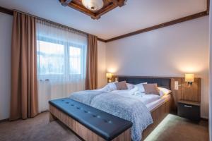A bed or beds in a room at Apartmany Krasvill