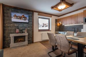 A kitchen or kitchenette at Apartmany Krasvill