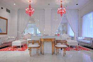 
a living room filled with furniture and decorations at Red South Beach Hotel in Miami Beach
