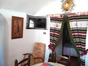 Posezení v ubytování Cuevas de María