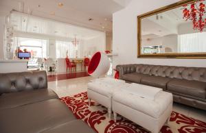 
a living room filled with furniture and decor at Red South Beach Hotel in Miami Beach
