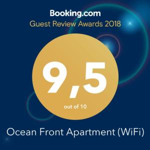 un front d’événement avec un cercle jaune et un texte de rendez-vous face à l’océan dans l'établissement Ocean Front Apartment (WiFi), à Tetir