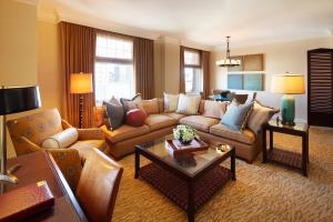 a living room with a couch and a table at Huntington Hotel in San Francisco