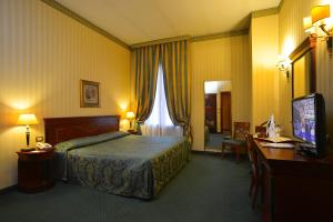 Säng eller sängar i ett rum på Zanhotel Europa