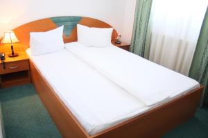 Postel nebo postele na pokoji v ubytování Hotel Sir Orhideea