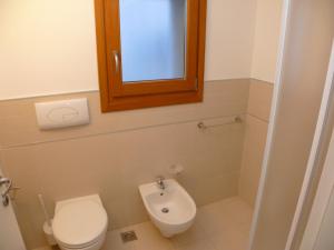 Koupelna v ubytování Bibione Mastervillage
